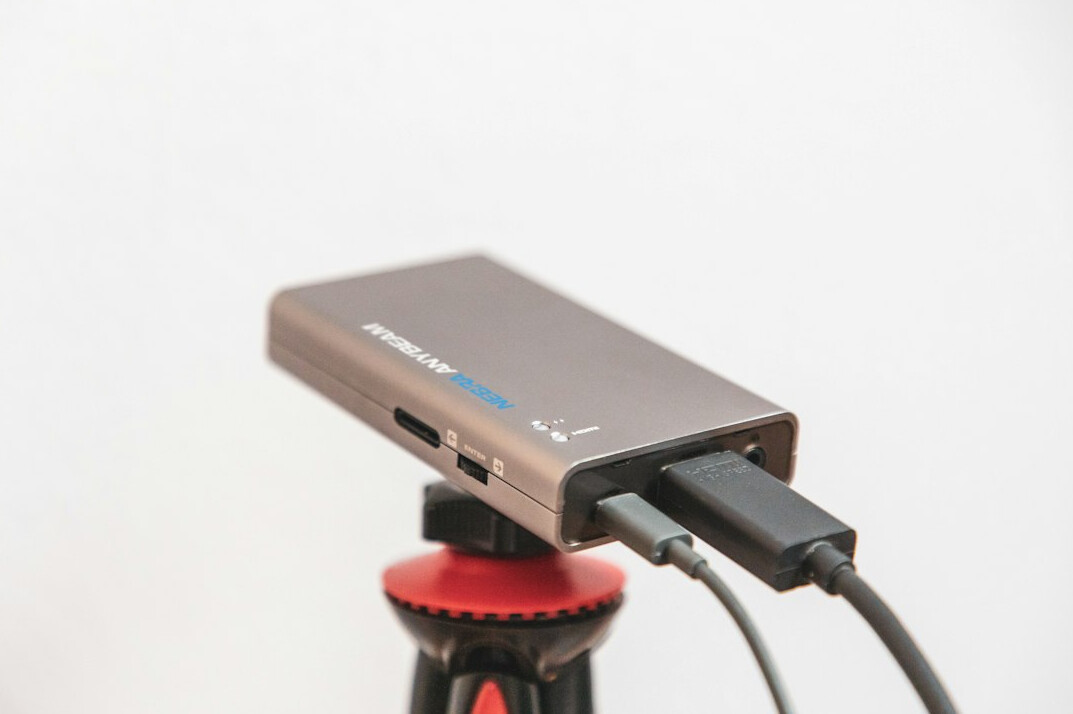 Streaming production setup with laptop, encoder and camera on a tripod